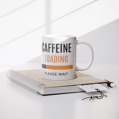 Caffeine_Loading-11oz_Ceramic_White_Mug_Lifestyle_Notebook_Mockup.png_15871209