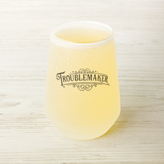 Troublemaker-13oz_Frosted_Stemless_Wine_Wine_Filled_Mockup.png_15861765